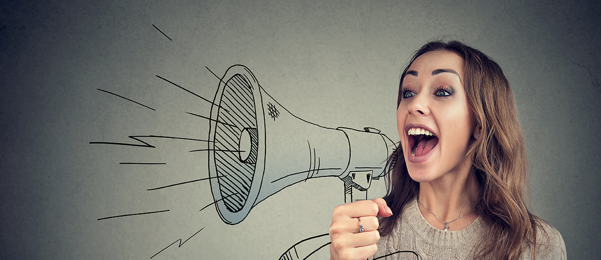 Woman with a loudspeaker speaking about her brands' voice.