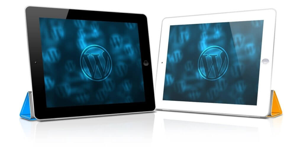 Two iPad's with WordPress logo on the screen.