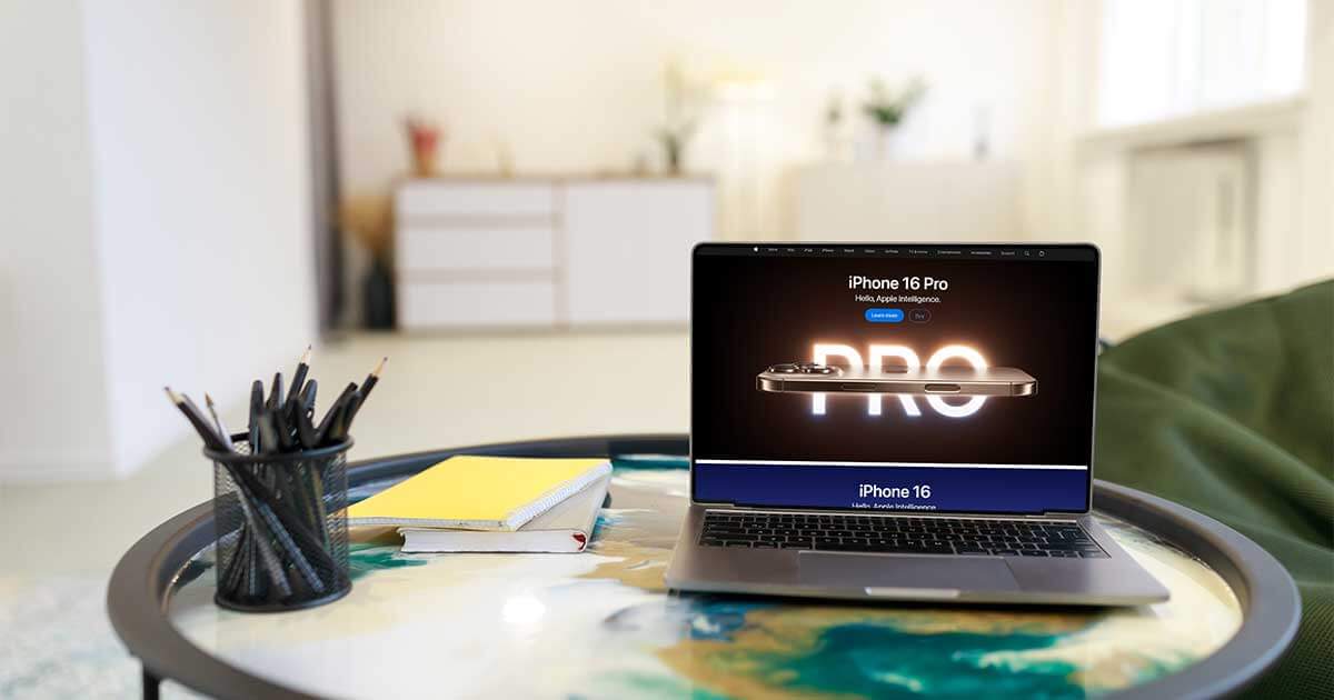 Laptop on table with Apple website on screen.
