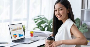Businesswoman-admiring results from great call to action ON her website.