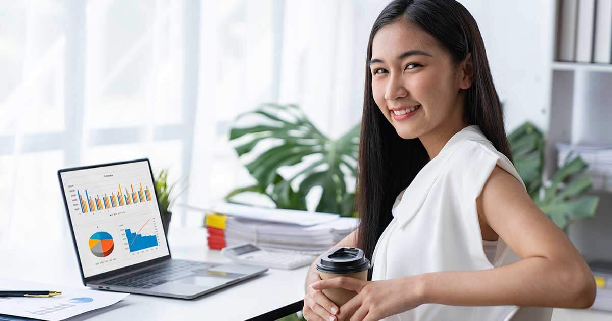 Businesswoman-admiring results from great call to action ON her website.
