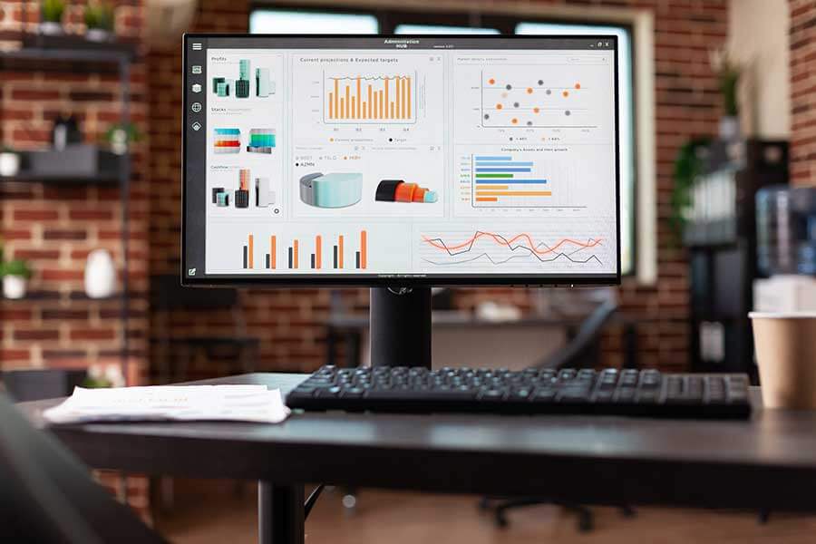 Close up of desk with business analysis charts and graphs.