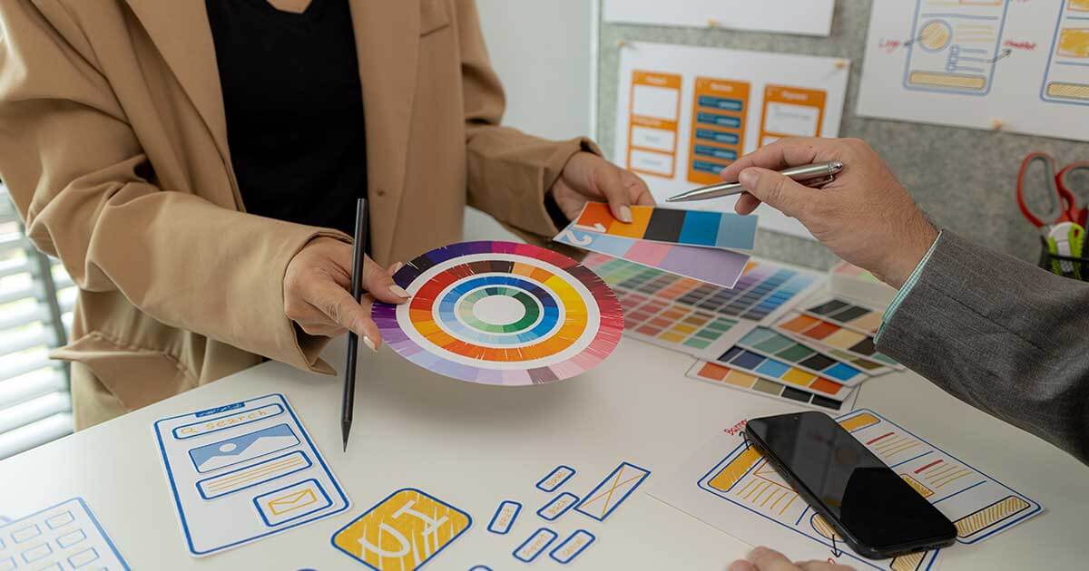 Designers making decisions for call to action design.
