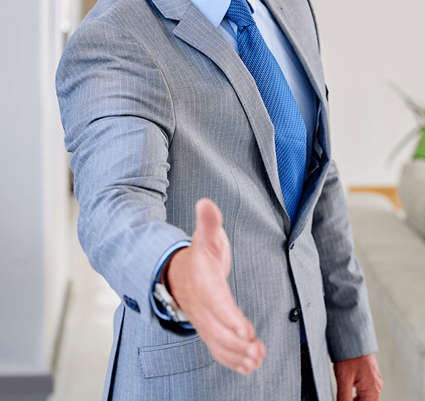Man reaching out to shake hands.