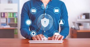 Man typing on keyboard with icons of website trust.