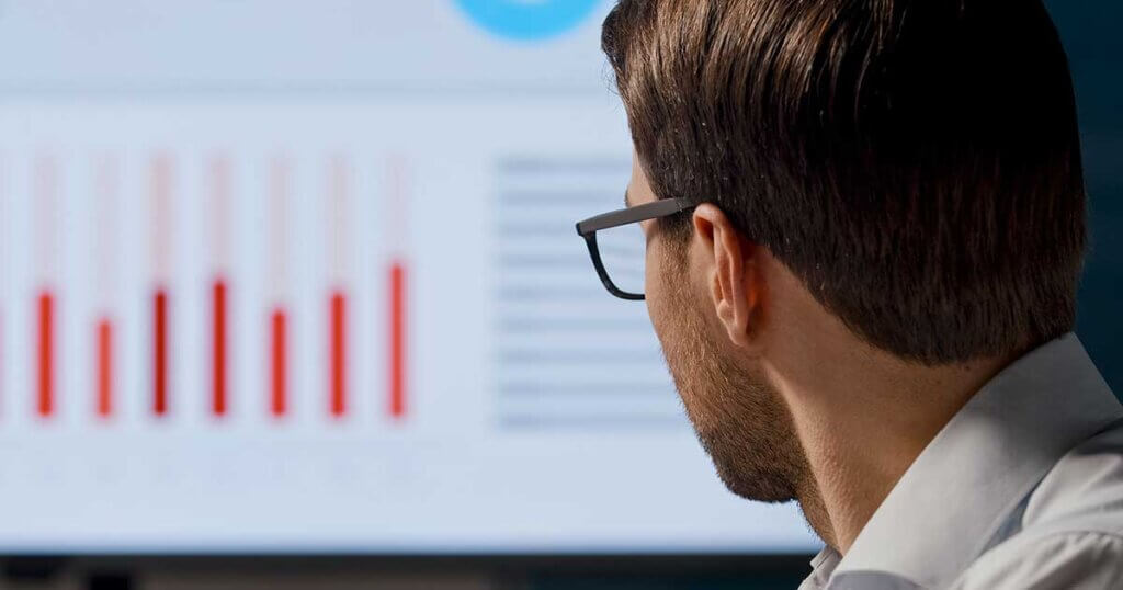 Young businessman working with AI analytics.