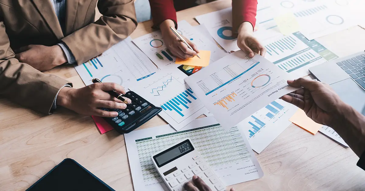 Business people teamwork calculating ROI.